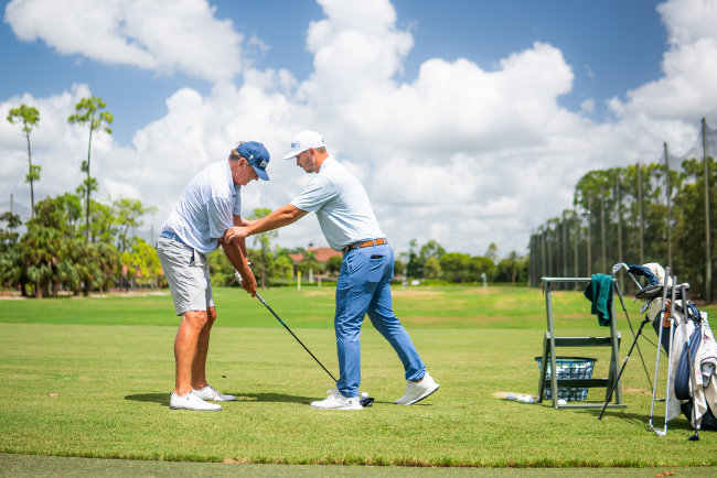 perfecting your grip: A golfer adjusting their grip on the club during a lesson at Olde Cypress.