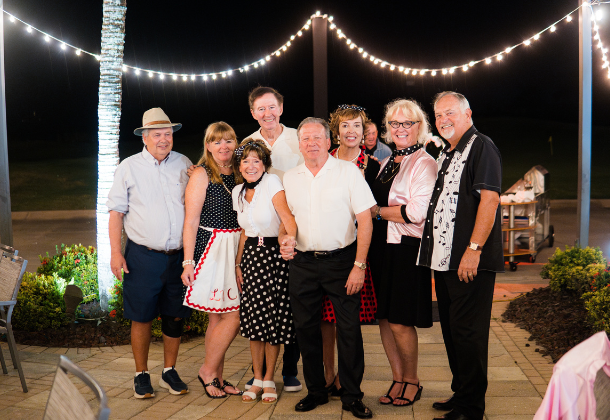 Members dancing and celebrating at the Rockin' '50s Party to kick off the season